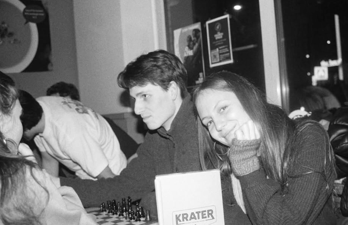 Playing chess at a table in the café