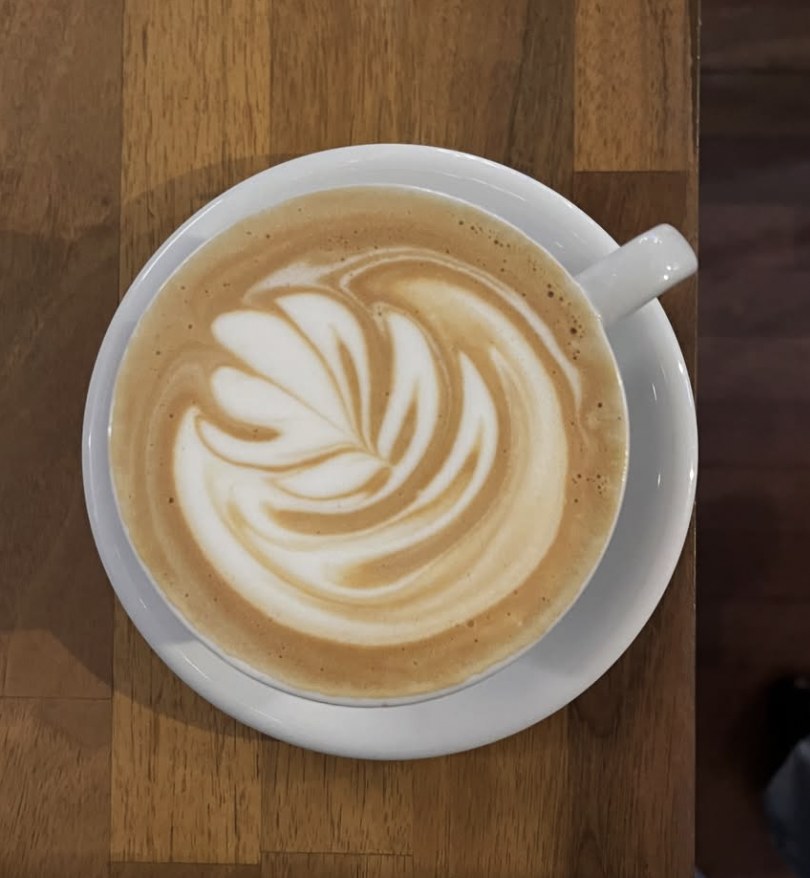 Cappuccino with latte art at De Krater